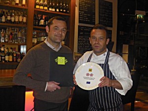 Front of house manager Jonathan Bowker and head chef Jethro Lawrence with the new AA Rosette plate.