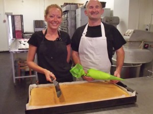 Cake being prepared by Grahame Hill and Sophie Hill