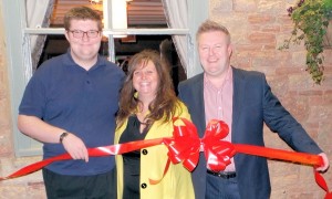 Left to right: George, Jenny and Marc conducting the ribbon cutting ceremony