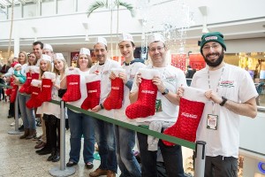 The first dozen customers with their limited edition Christmas stockings at Krispy Kreme's latest store opening at The Mall at Cribbs Causeway
